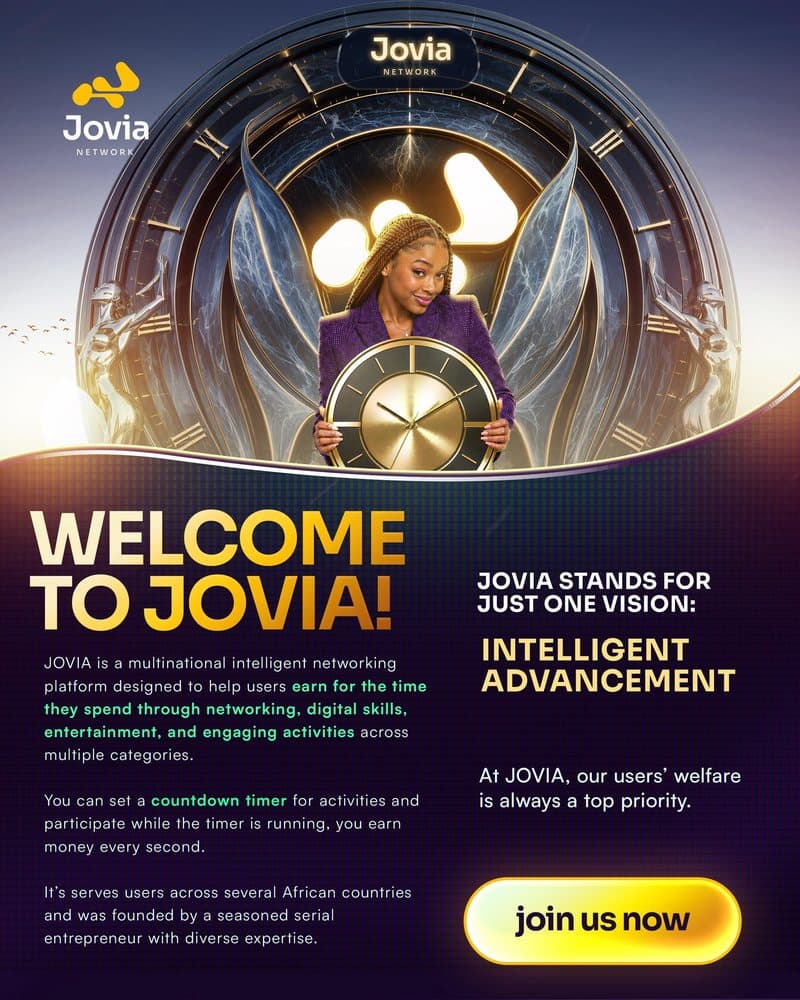 Jovia member holding an oversized gold clock